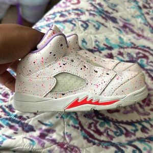 Jordan’s, 8C, mainly white with purple, pink and orange splashes